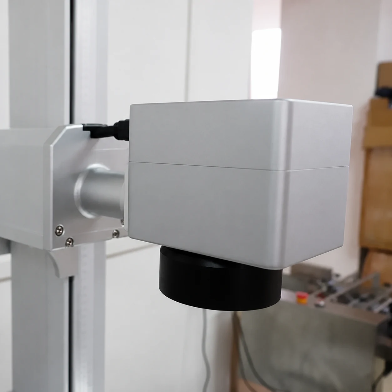 Close-up of a fiber laser marking galvo scanner
